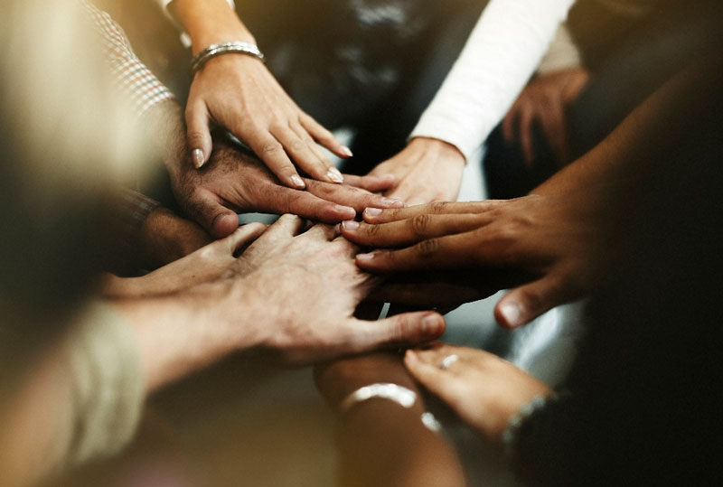 Hands crossed representing union and agreement